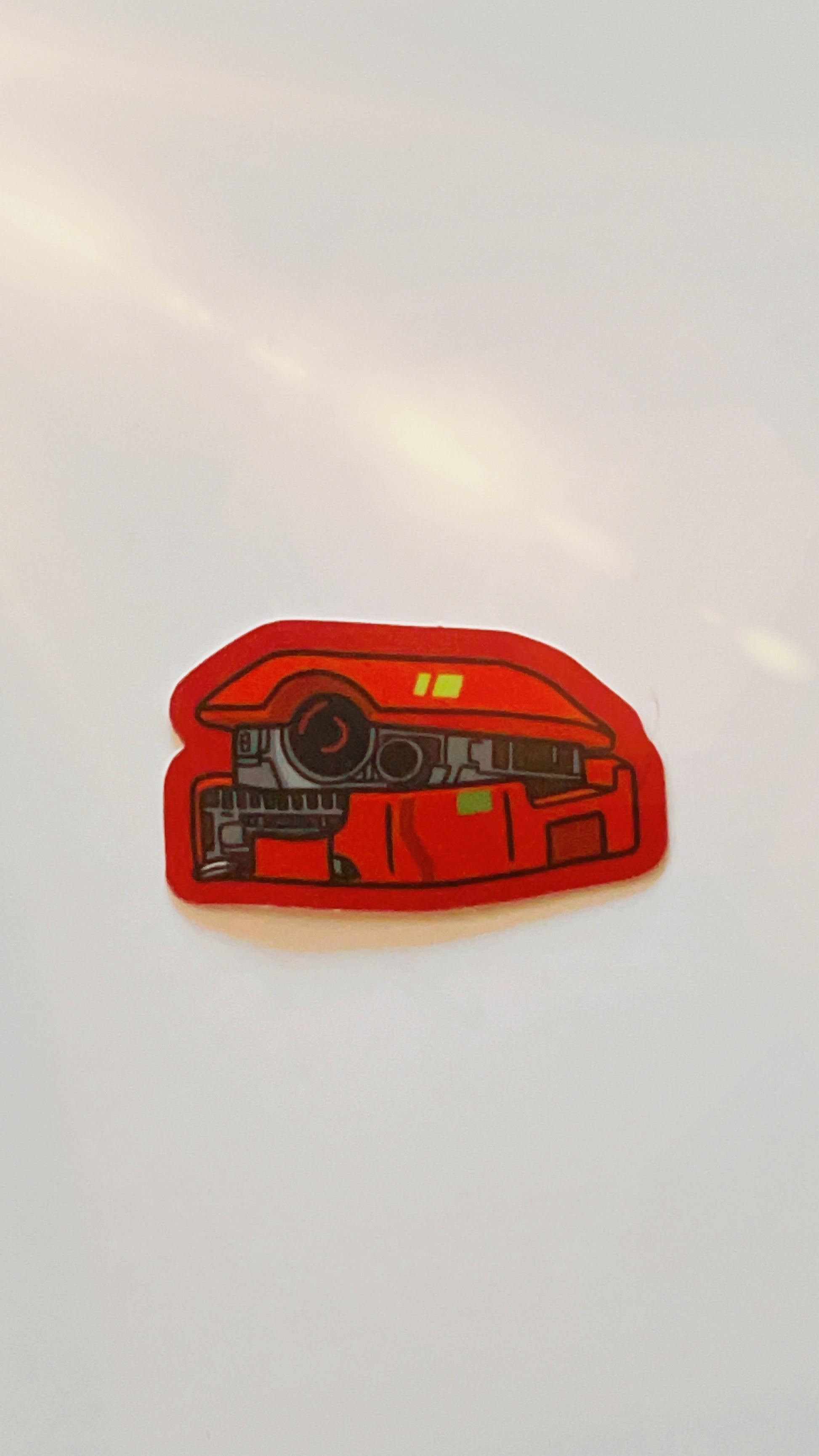 Vinyl sticker of star wars droid b2emo with red edges.