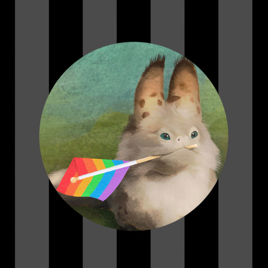 Circle sticker of a loth cat holding a rainbow pride flag in its mouth with a blue to green background.