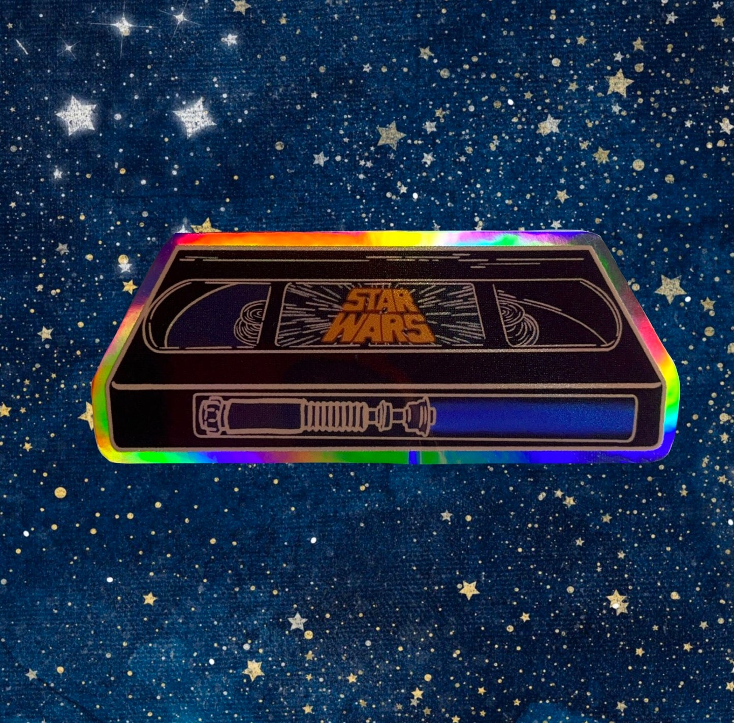 sticker of a blue VHS tape of star wars in holographic vinyl