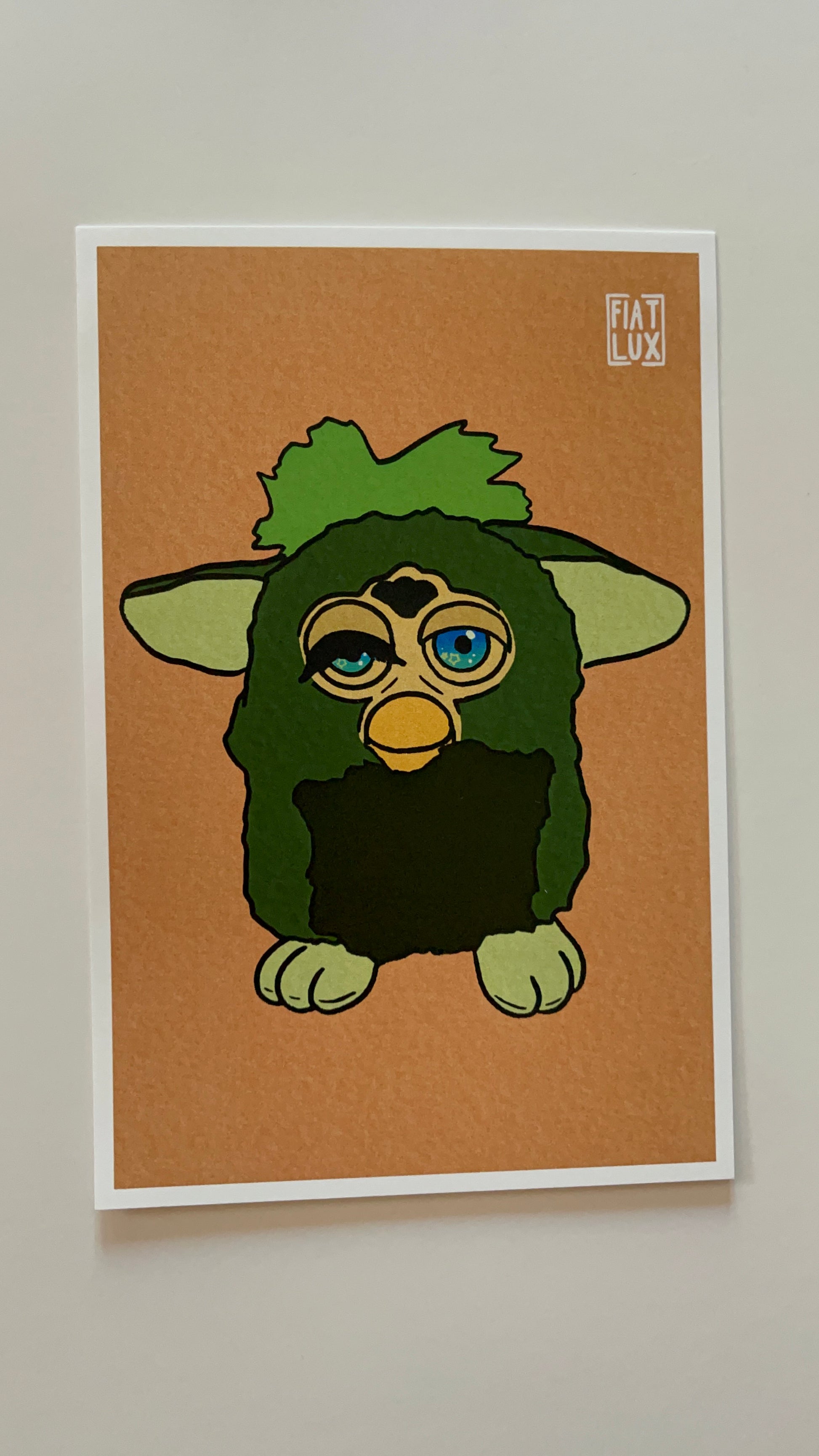 Art print of a furby with a missing eyelash and one eye drooping on a solid soft orange background.