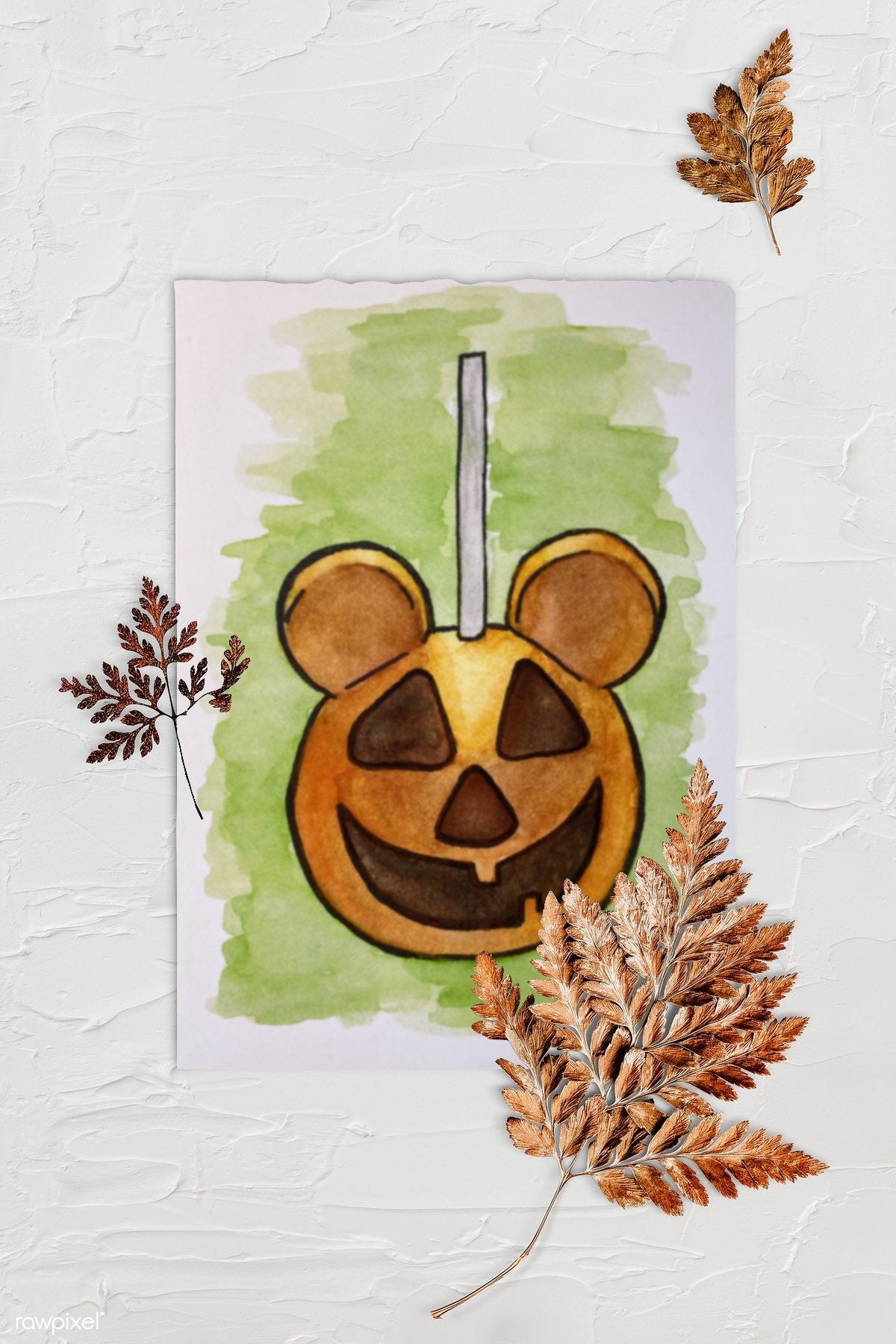 Halloween Jack O Lantern Mouse Dessert Food Illustration - The Happiest Caramel Apples on Earth. Background is textured white with three browned fern leaves. Art print is lying in center with rough edges.