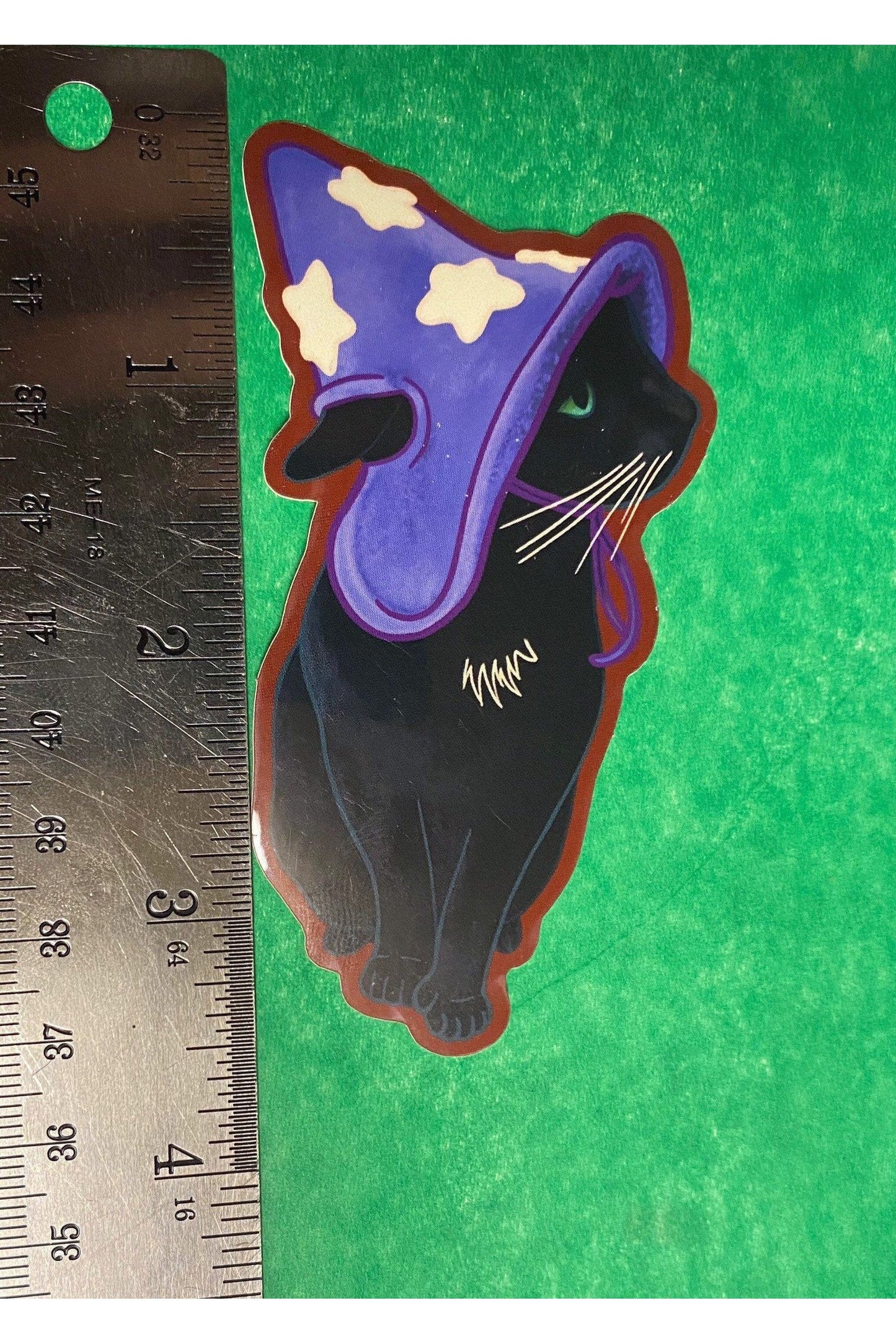 Vinyl Sticker black Kitty in a purple Wizard hat with white stars