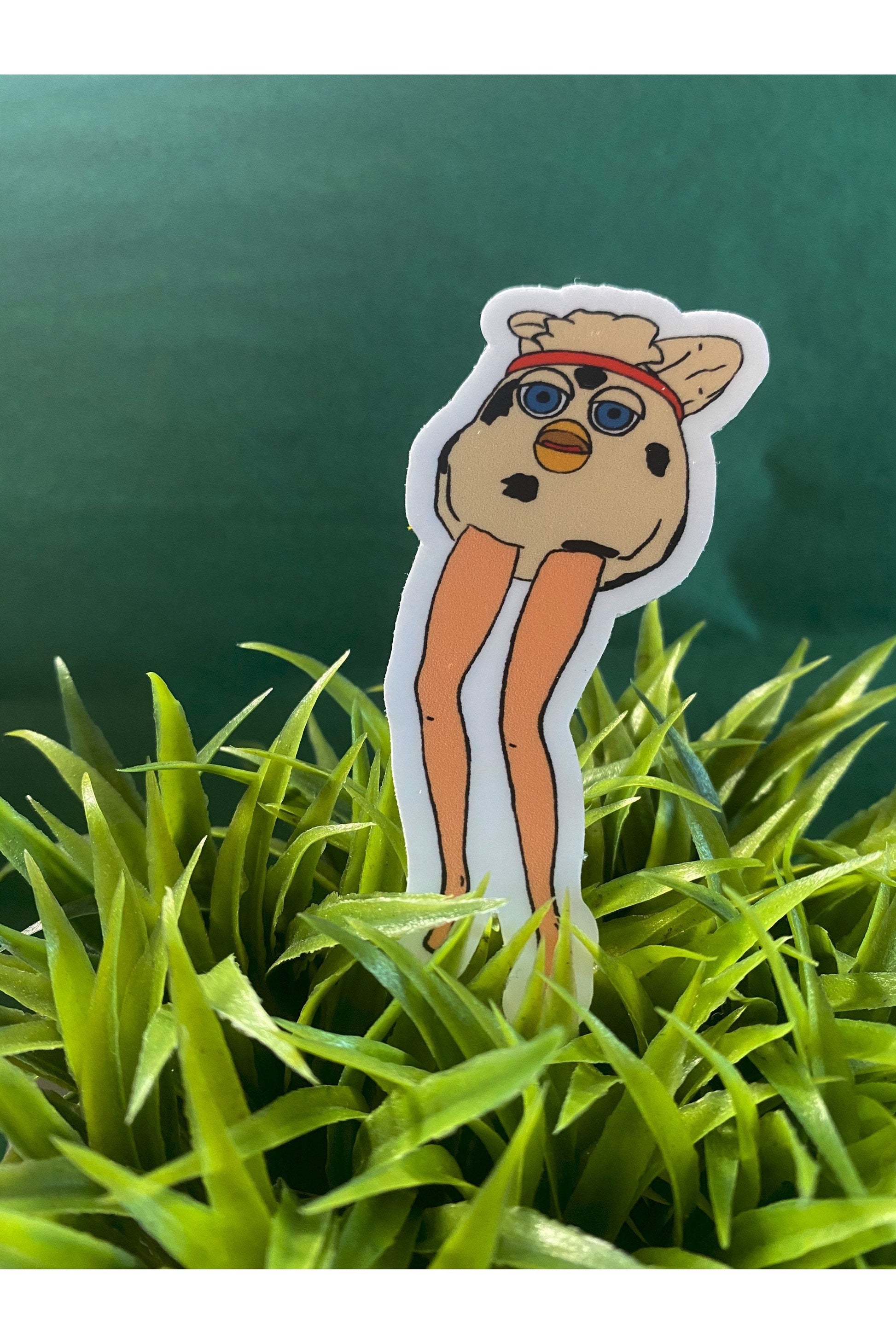 vinyl sticker of a furby modified with long doll legs
