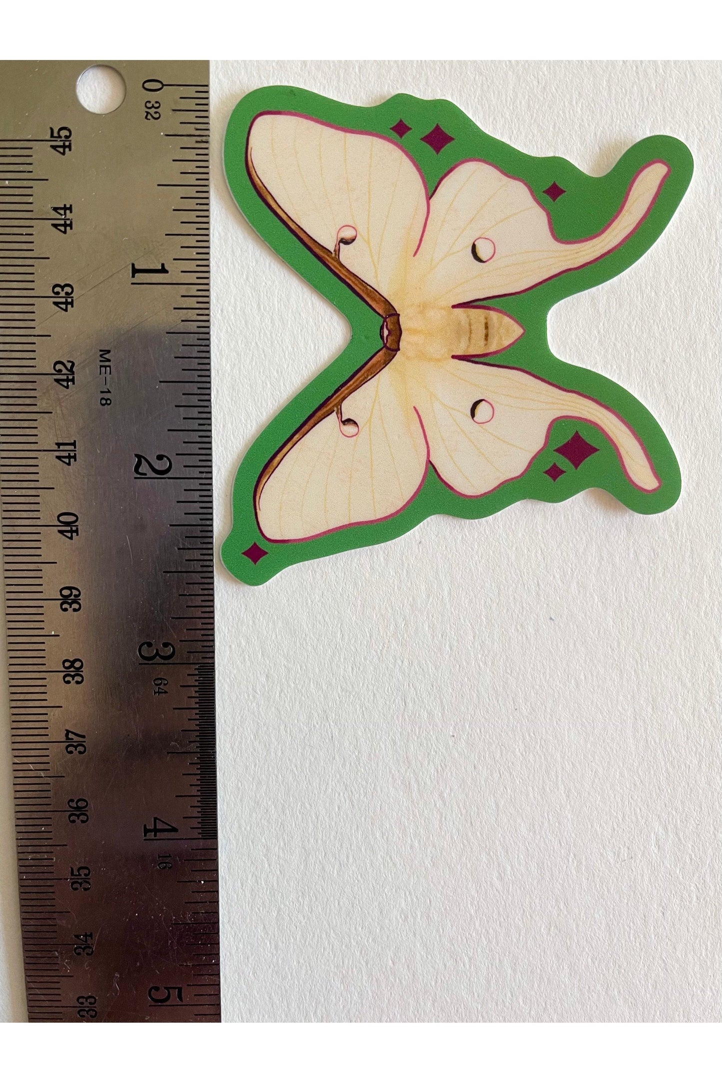 vinyl sticker of a Luna Moth (white tones) with light green edges