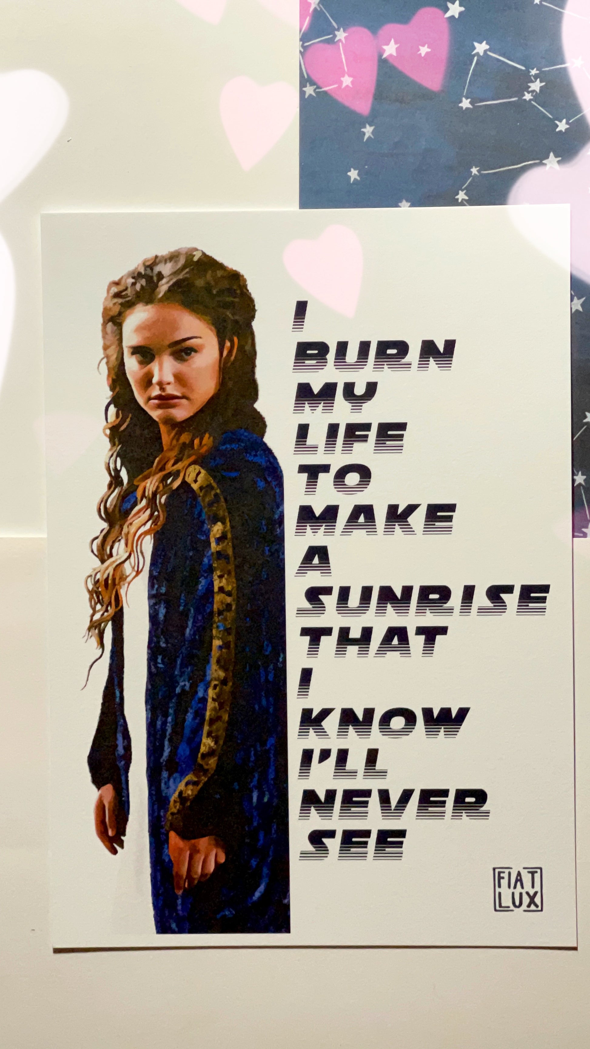 Art print of Padme Amidala from Attack of the Clones with the andor quote "I burn my life to make a sunrise that I know I'll never see" in blue text.