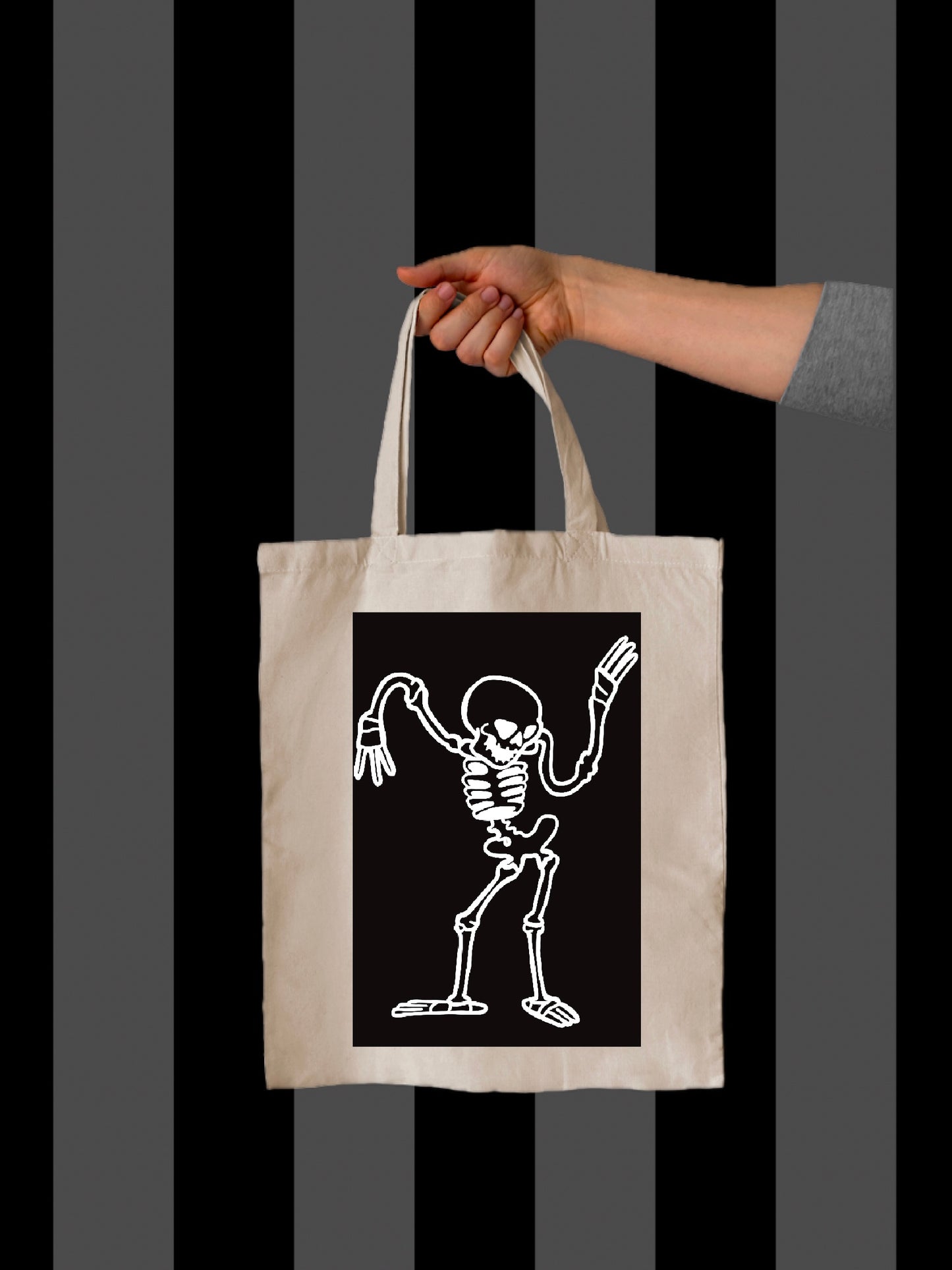 Canvas tote bag with a cartoon skeleton dancing design in black
